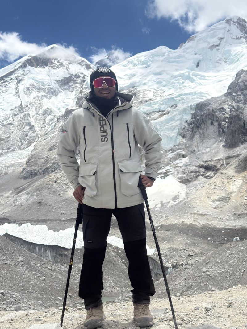 Soumya standing in the Himalayas